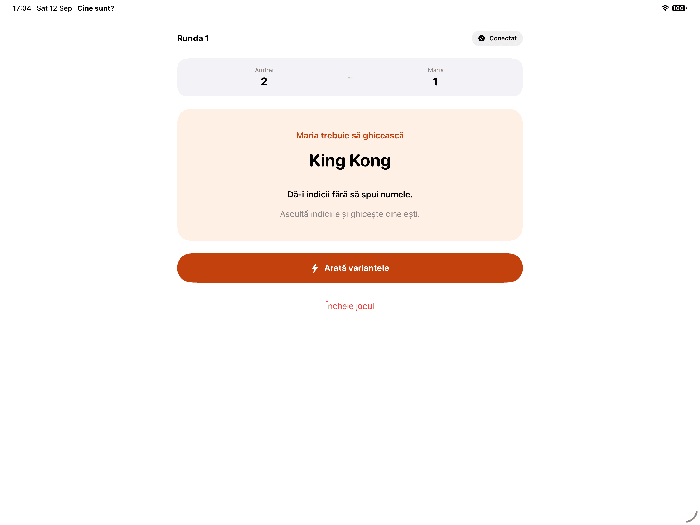 An iPad round: Andrei’s screen shows King Kong, the identity Maria needs to guess.